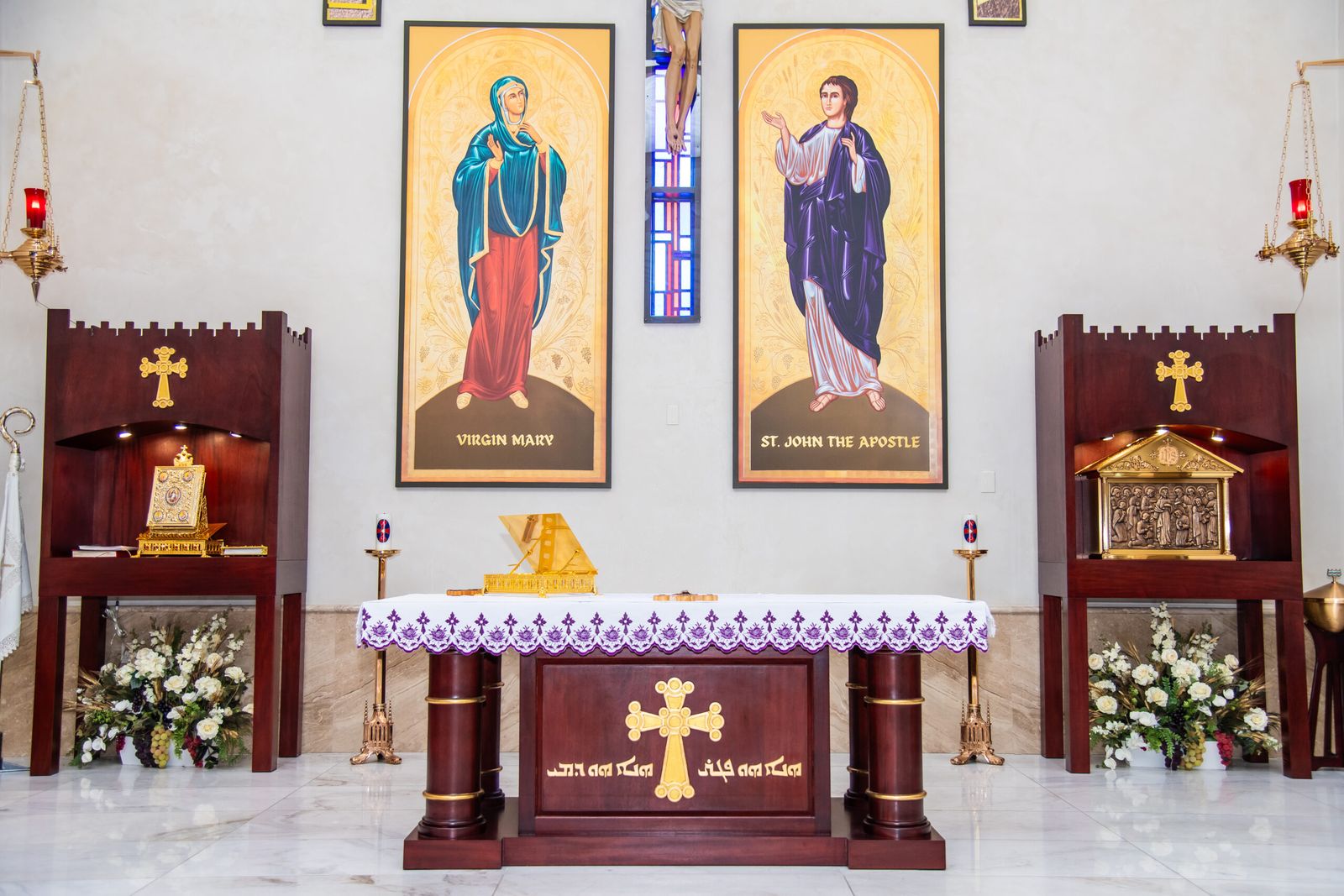 An altar beneath icons of the Virgin Mary and St. John the Apostle