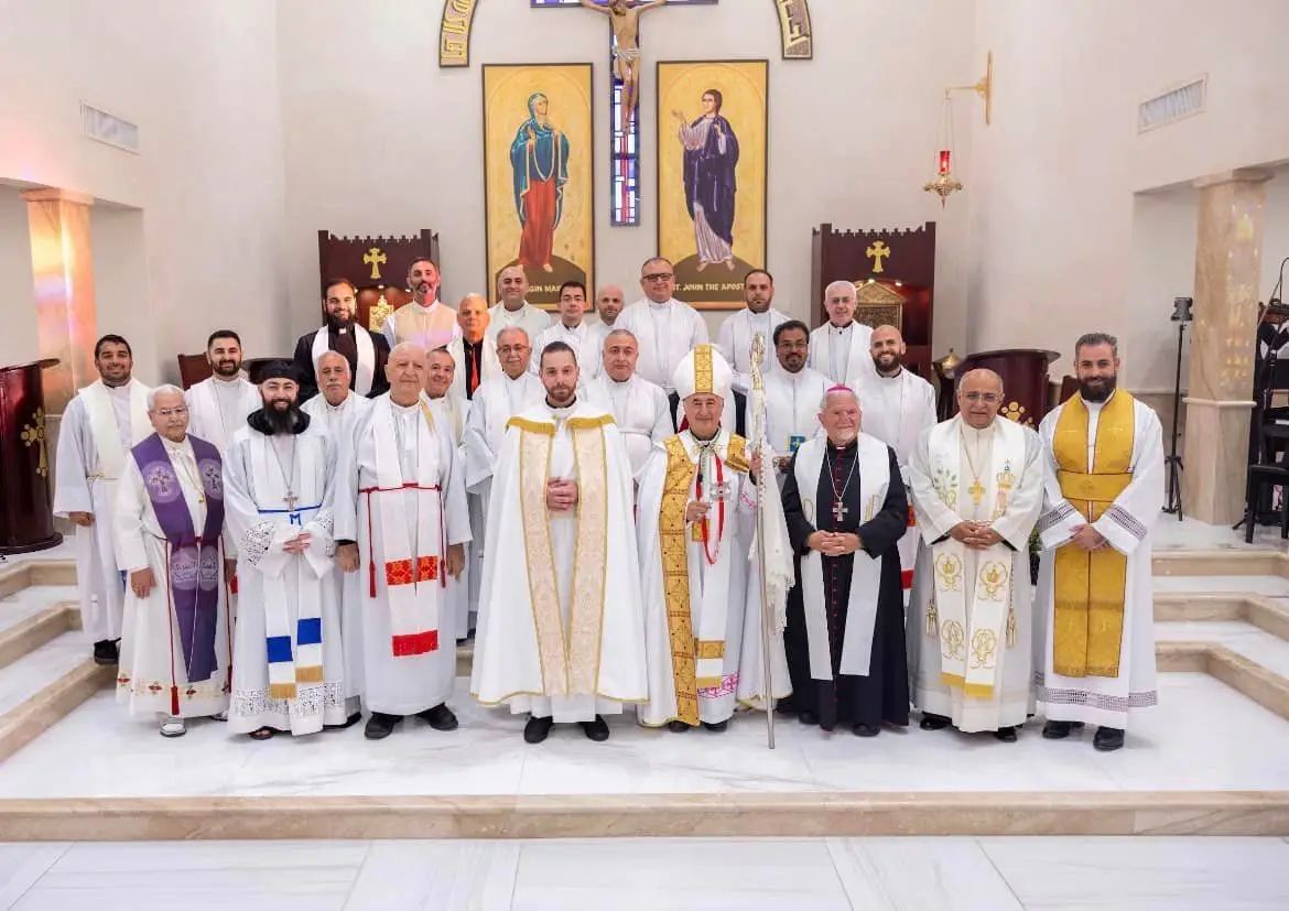 Clergy and deacons of the eparchy gathered in a sanctuary