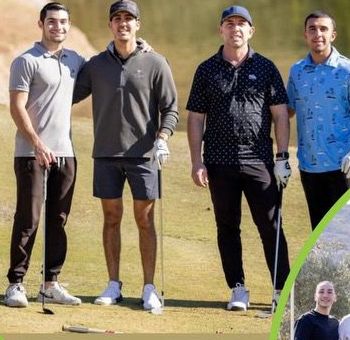 A foursome of golfers on the course