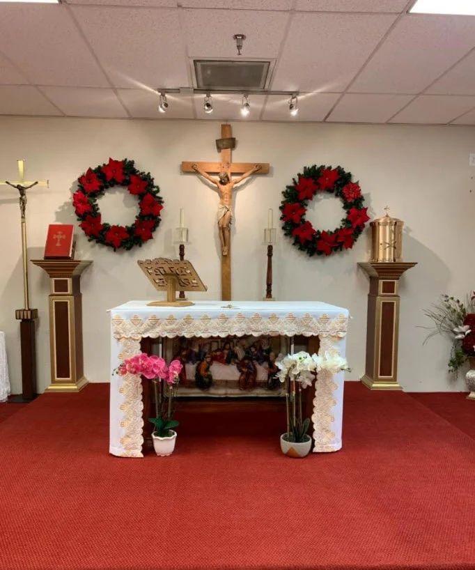The altar of St. Barbara decorated with Christmas wreaths and poinsettias